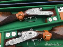 Importante coppia di Fabbrizioli side lock fucili gemelli cal 12 incisione Fabbrizioli numeriate