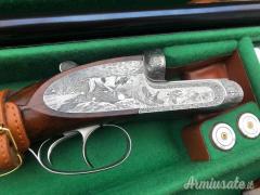 Importante coppia di Fabbrizioli side lock fucili gemelli cal 12 incisione Fabbrizioli numeriate