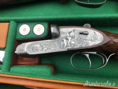 Importante coppia di Fabbrizioli side lock fucili gemelli cal 12 incisione Fabbrizioli numeriate