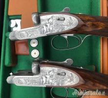 Importante coppia di Fabbrizioli side lock fucili gemelli cal 12 incisione Fabbrizioli numeriate