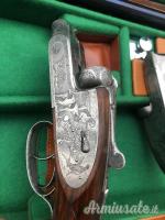 Importante coppia di Fabbrizioli side lock fucili gemelli cal 12 incisione Fabbrizioli numeriate