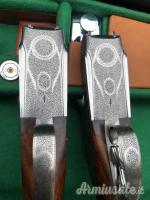 Importante coppia di Fabbrizioli side lock fucili gemelli cal 12 incisione Fabbrizioli numeriate