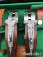 Importante coppia di Fabbrizioli side lock fucili gemelli cal 12 incisione Fabbrizioli numeriate