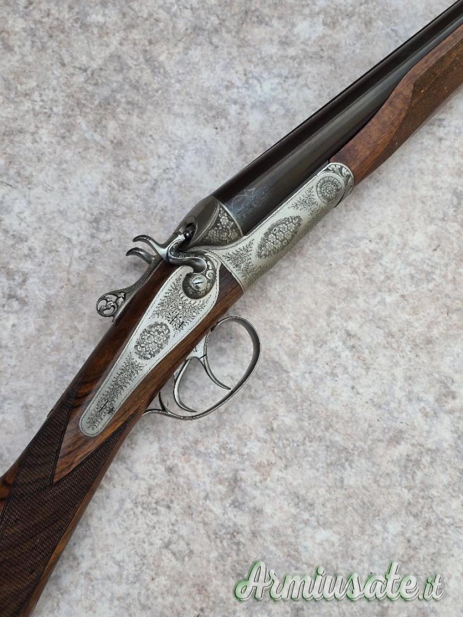 Doppietta cani esterni Boniotti cal 12 canne 70 incisione firmata Guerini proveniente da collezione Doppietta cani esterni Boniotti cal 12 canne 70 incisione firmata Guerini proveniente da collezione