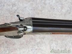 Doppietta cani esterni Boniotti cal 12 canne 70 incisione firmata Guerini proveniente da collezione Doppietta cani esterni Boniotti cal 12 canne 70 incisione firmata Guerini proveniente da collezione