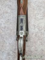 Doppietta cani esterni Boniotti cal 12 canne 70 incisione firmata Guerini proveniente da collezione Doppietta cani esterni Boniotti cal 12 canne 70 incisione firmata Guerini proveniente da collezione