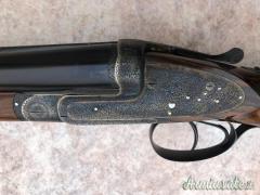 Toschi batterie side lock holland cal 12 con 2 paia di canne da 74 e 71 incisione Fabbrizioli