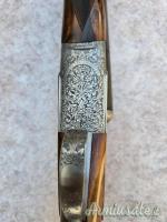 Doppietta Beretta 451 EL cal 12 canne 68 cl/3* incisione firmata Bertella legno grado 5