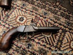 Armi antiche Rast & Gasser Wien e pistola a luminello