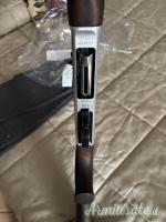 Benelli 121 12 inciso con legni in radica d’ulivo.