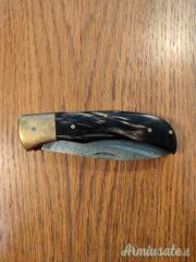 Coltello tascabile artigianale in acciaio Damasco e corno